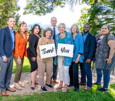 ACHF board members hold thank you signs
